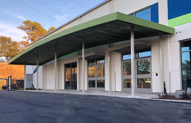 Post supported arched canopy