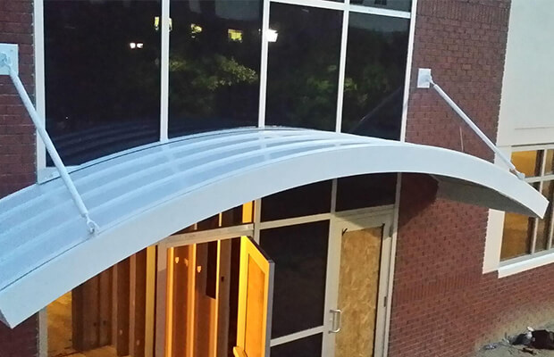 Hanger supported arched canopy